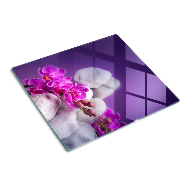 Doska na krájanie Kvety orchideí na pozadí kameňov