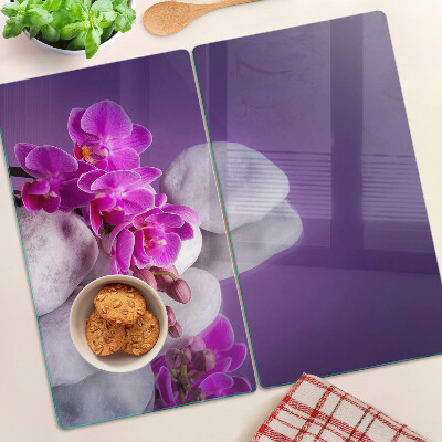 Doska na krájanie Kvety orchideí na pozadí kameňov