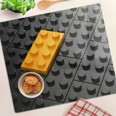 Doska na krájanie LEGO kocky na čiernom pozadí