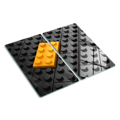 Doska na krájanie LEGO kocky na čiernom pozadí