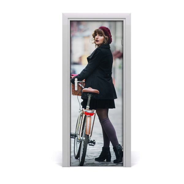 Fototapeta samolepiace dvere žena na bicykli