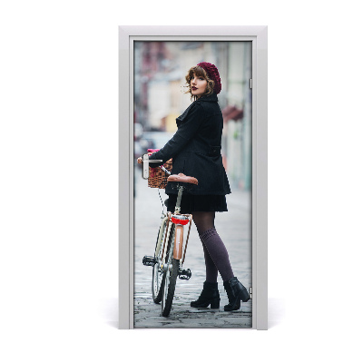 Fototapeta samolepiace dvere žena na bicykli