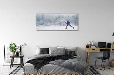 Obraz plexi Les v zime sneh muž