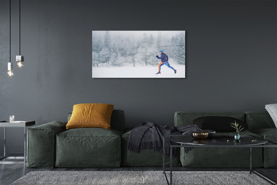 Obraz plexi Les v zime sneh muž