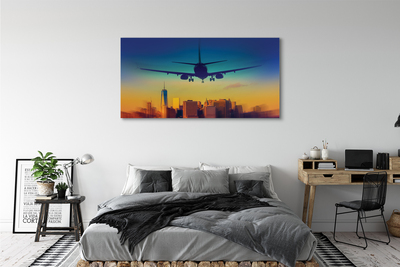 Obraz canvas Veľkomesto oblačnosti lietadlo západ