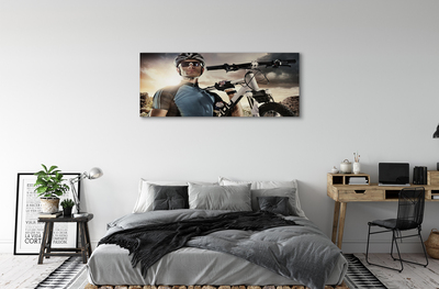 Obraz canvas Cyklista na bicykli mraky