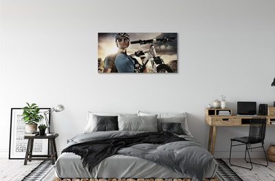 Obraz canvas Cyklista na bicykli mraky