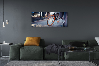 Obraz canvas Mesto na bicykli noha
