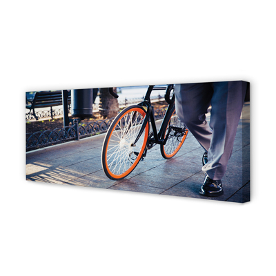 Obraz canvas Mesto na bicykli noha