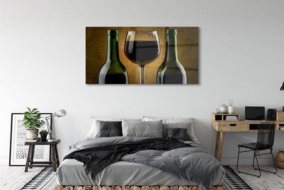 Obraz na skle 2 fľaše poháre na víno