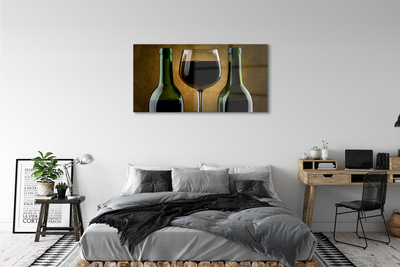Obraz na skle 2 fľaše poháre na víno
