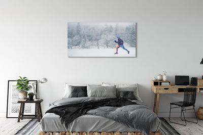 Obraz na skle Les v zime sneh muž