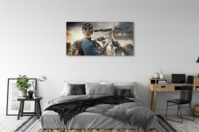 Obraz na skle Cyklista na bicykli mraky