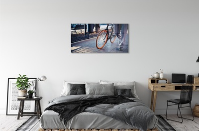 Obraz na skle Mesto na bicykli noha