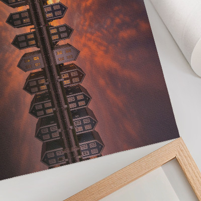 Poster Farebné domy pri vode vo svetle západu slnka