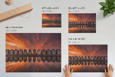 Poster Farebné domy pri vode vo svetle západu slnka