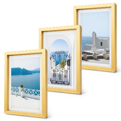 Triptych v ráme Výhľady na more s bielymi budovami v Grécku