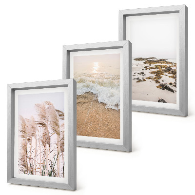 Triptych v ráme Vlny plážovej trávy a kamene pri mori v štýle boho